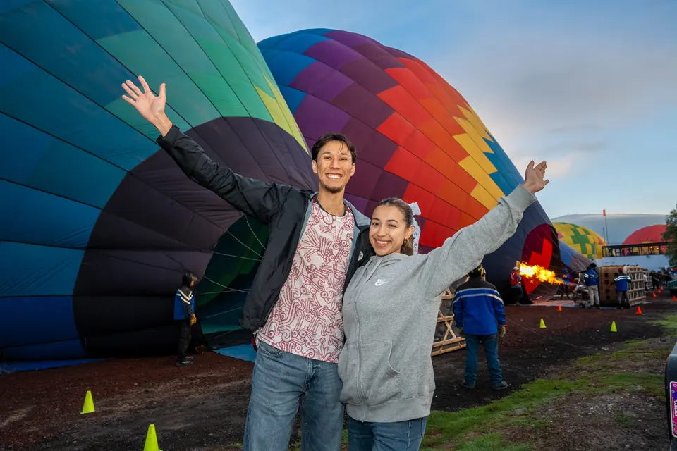 Couple embracing on the basket before their sunrise balloon flight in Teotihuacan